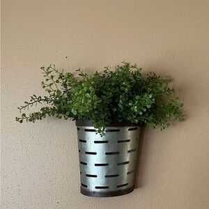 Farmhouse style - metal olive bucket wall decor with greenery